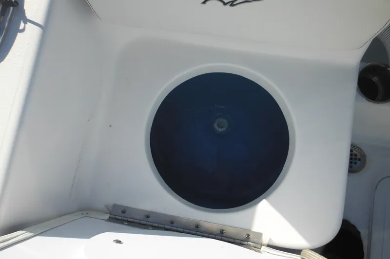 Slide: The Image of Livewell on 2026 Tidewater 180 CC Adventure boat, featuring a blue interior. - 28