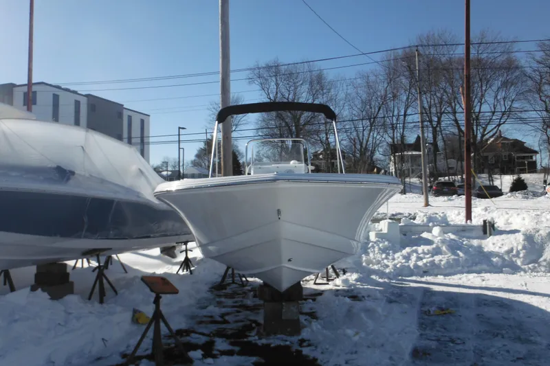Slide: The Image of 2026 Tidewater 180 CC Adventure boat in snowy outdoor storage. - 3