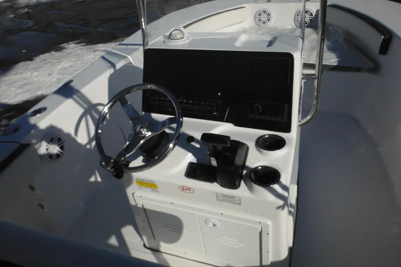 Slide: The Image of 2026 Tidewater 180 CC Adventure boat console with steering wheel and controls. - 30