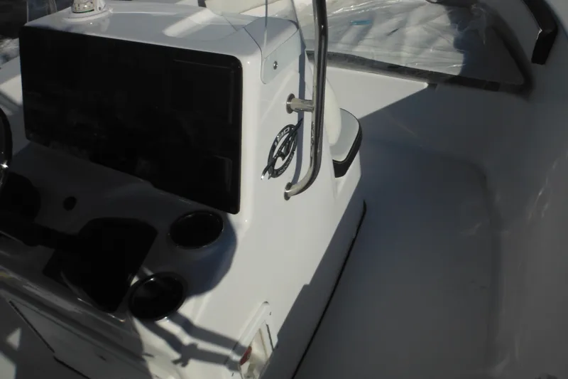 Slide: The Image of 2026 Tidewater 180 CC Adventure boat console with steering wheel and controls. - 31