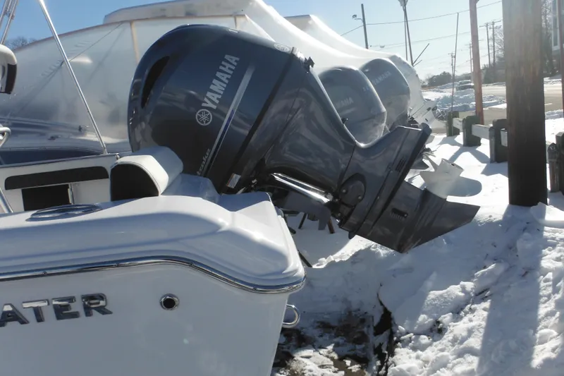 Slide: The Image of Tidewater 180 CC Adventure 2026 boat with Yamaha outboard motor in snowy setting. - 4