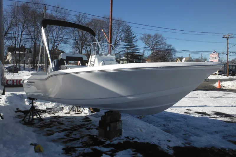 Slide: The Image of 2026 Tidewater 180 CC Adventure boat on display in snowy outdoor setting. - 6