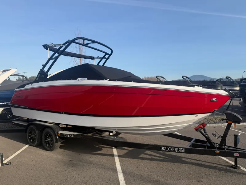 Slide: The Image of 2026 Cobalt R6 boat on a trailer outdoors. - 2