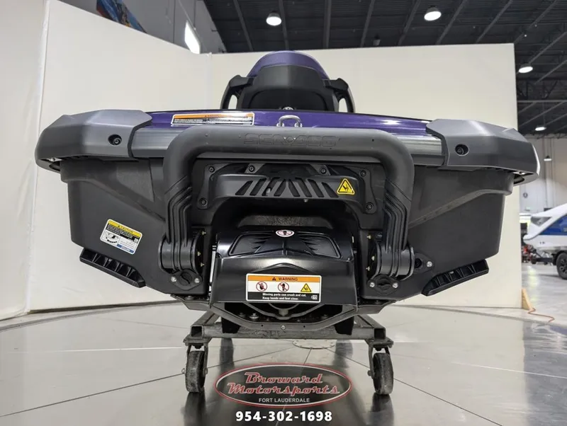 Slide: The Image of Rear view of a 2025 Sea-Doo GTI SE 130 jet ski in showroom. - 8