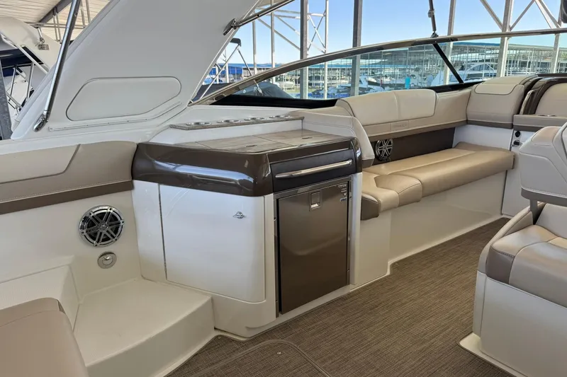Slide: The Image of 2018 Formula 310 Bowrider interior with seating and built-in amenities. - 14