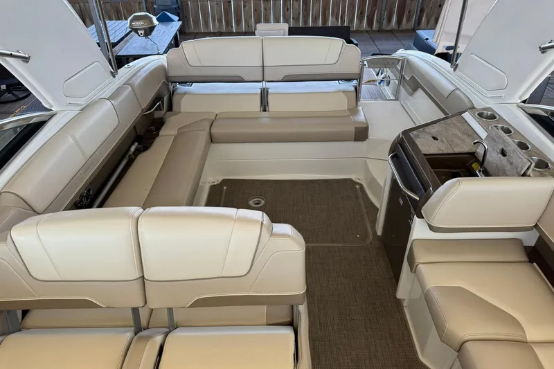 Slide: The Image of Luxurious interior of a 2018 Formula 310 Bowrider boat with beige seating and amenities. - 16