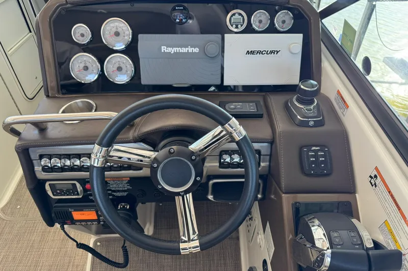 Slide: The Image of Dashboard of a 2018 Formula 310 Bowrider with Raymarine and Mercury controls. - 21