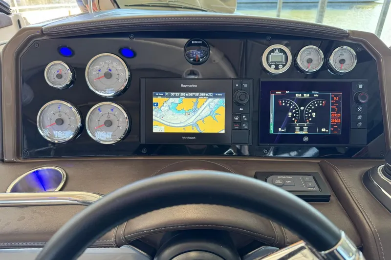 Slide: The Image of Dashboard of 2018 Formula 310 Bowrider with navigation and control displays. - 23