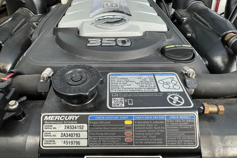 Slide: The Image of Mercury engine maintenance label on a 2018 Formula 310 Bowrider boat. - 29
