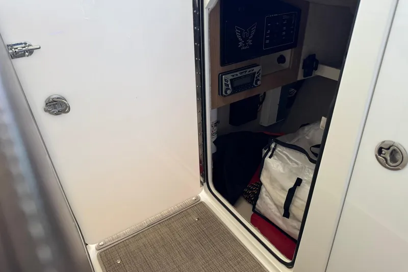 Slide: The Image of 2018 Formula 310 Bowrider cabin interior with storage and control panel. - 33