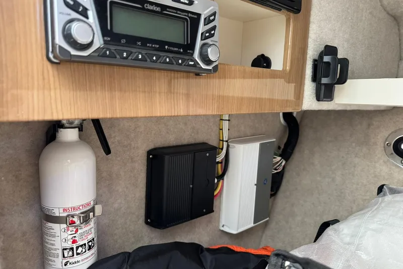 Slide: The Image of 2018 Formula 310 Bowrider interior with stereo system and fire extinguisher. - 34