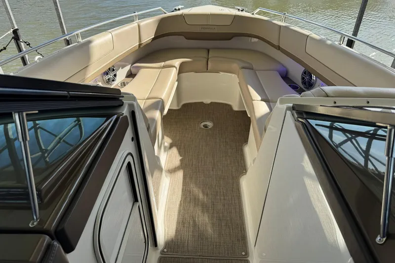 Slide: The Image of 2018 Formula 310 Bowrider interior with beige seating and carpeted floor. - 36