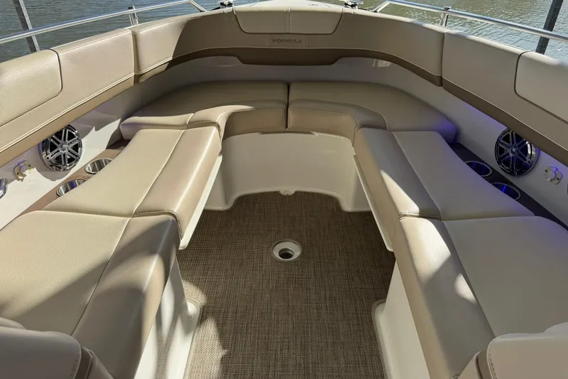 Slide: The Image of 2018 Formula 310 Bowrider interior with beige seating and carpeted flooring. - 37