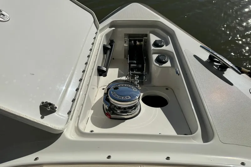 Slide: The Image of 2018 Formula 310 Bowrider anchor compartment with winch and chain. - 39