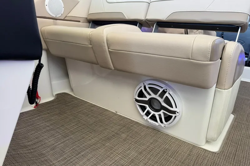 Slide: The Image of 2018 Formula 310 Bowrider interior with beige seating and built-in speaker. - 41