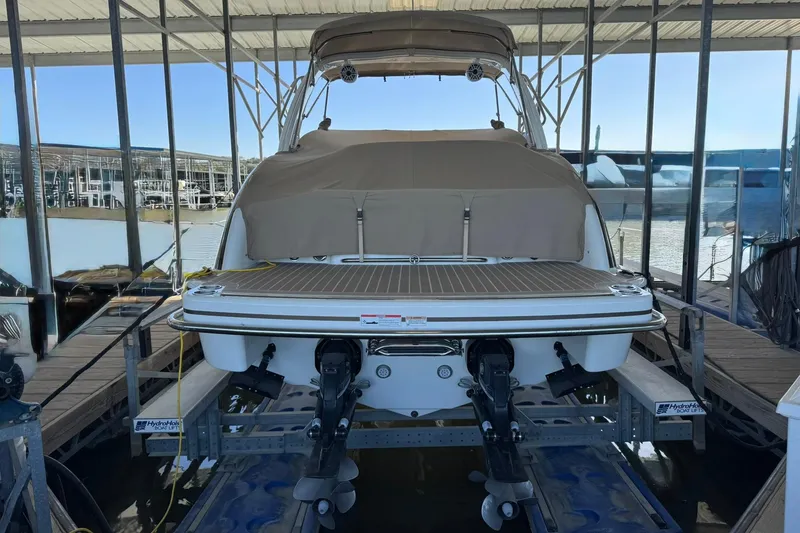 Slide: The Image of 2018 Formula 310 Bowrider on boat lift in marina, rear view. - 5