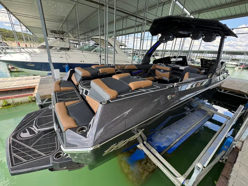 Slide: The Image of 2025 Tigé Ultré 25ZX boat in dock, luxurious design. - 4