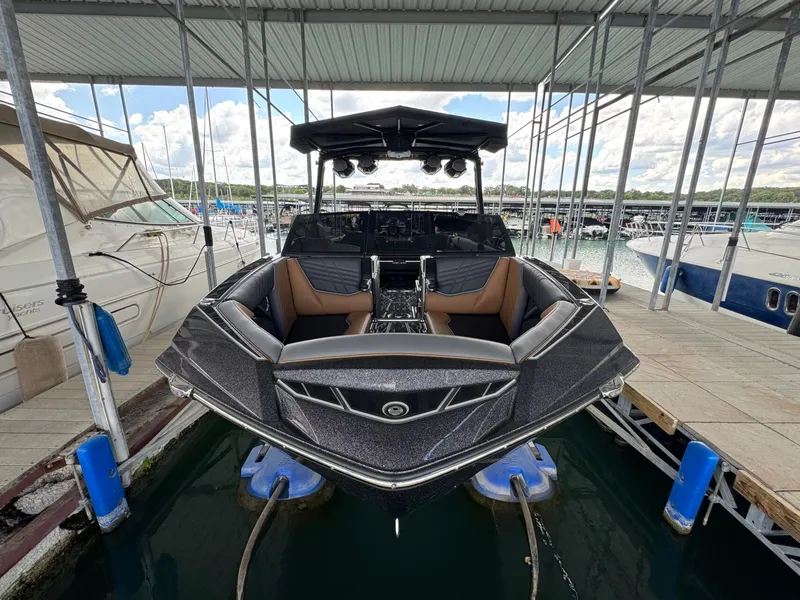 Slide: The Image of 2025 Tigé Ultré 25ZX boat docked, featuring modern design. - 7