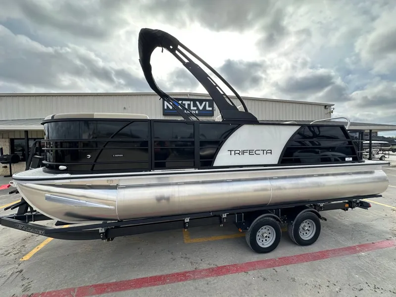 The Image of 2026 Trifecta 22 UL CS pontoon boat on trailer. - 1