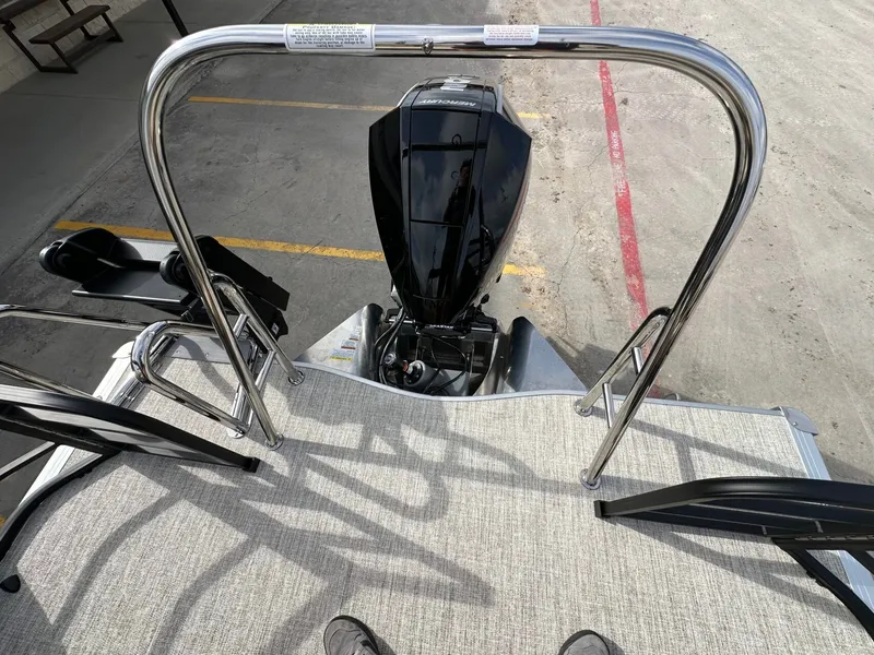 Slide: The Image of Trifecta 22 UL CS 2026 with outboard motor and railing. - 11