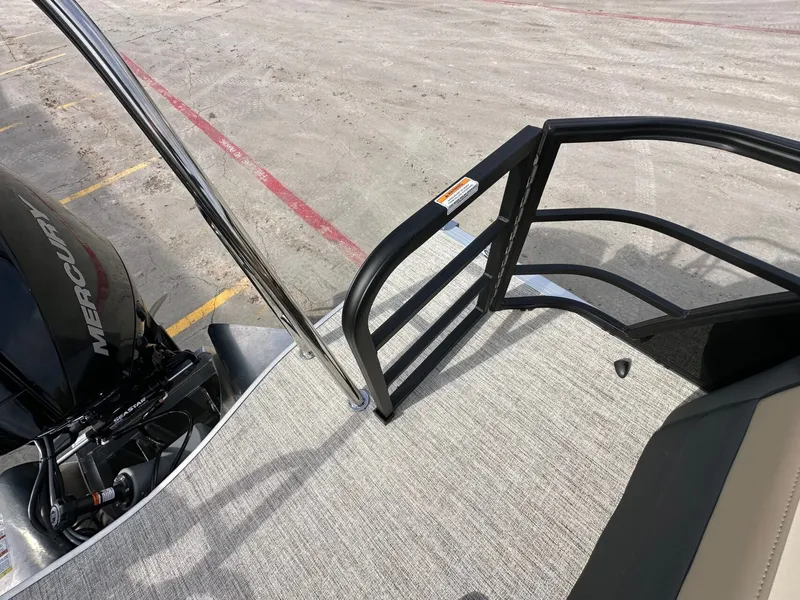 Slide: The Image of Trifecta 22 UL CS 2026 pontoon boat with Mercury engine. - 12