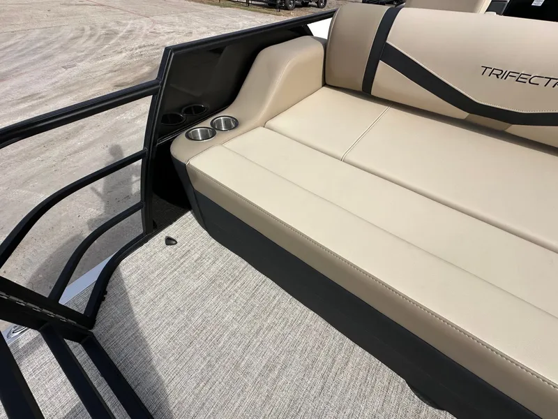 Slide: The Image of Interior of 2026 Trifecta 22 UL CS with beige seating and cup holders. - 14