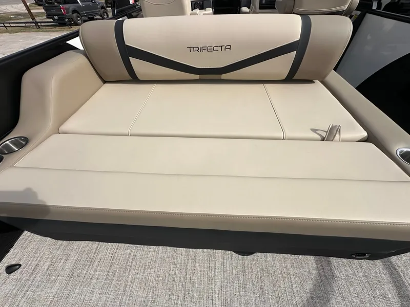 Slide: The Image of Trifecta 22 UL CS 2026 boat seat with beige upholstery. - 15