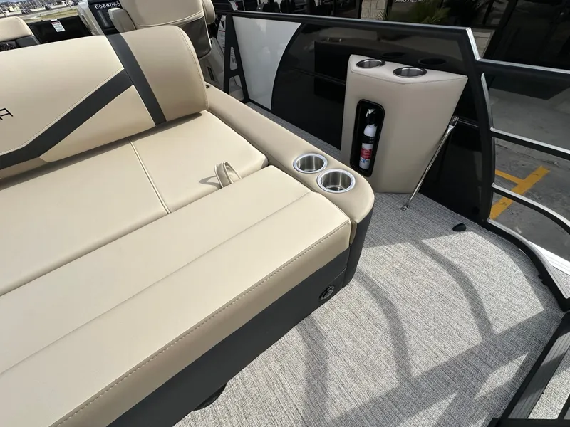 Slide: The Image of Interior of 2026 Trifecta 22 UL CS with beige seats and cup holders. - 16