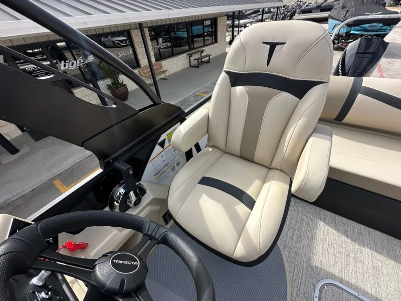 Slide: The Image of Trifecta 22 UL CS 2026 boat helm with luxurious captain's chair. - 32