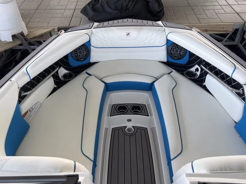 Slide: The Image of Interior of 2021 Nautique GS24 with blue and white seating. - 10