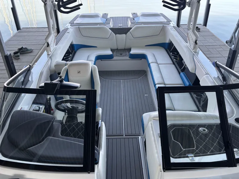 Slide: The Image of Interior view of a 2021 Nautique GS24 boat at the dock. - 12
