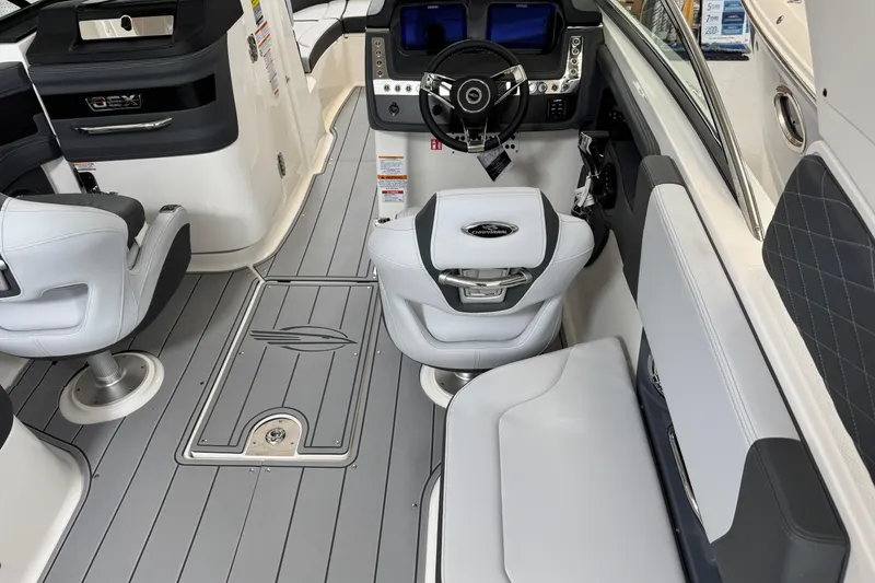 Slide: The Image of 2026 Chaparral 270 OSX boat interior with modern helm and seating. - 10