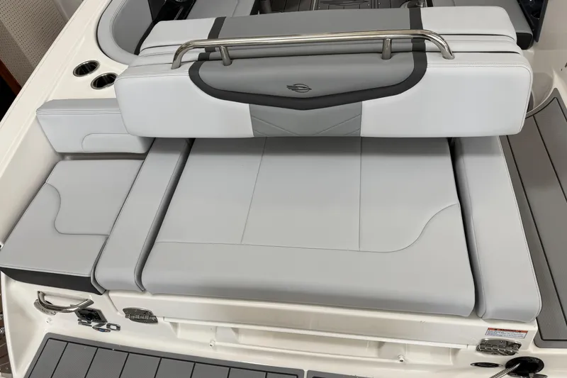 Slide: The Image of 2026 Chaparral 270 OSX boat with sleek, modern seating and stainless steel accents. - 11