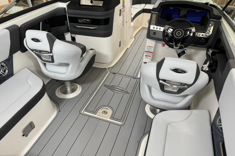 Slide: The Image of Interior of 2026 Chaparral 270 OSX boat with modern seating and dashboard. - 12