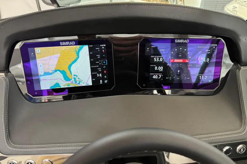 Slide: The Image of Dashboard of 2026 Chaparral 270 OSX with dual Simrad displays showing navigation and engine data. - 15