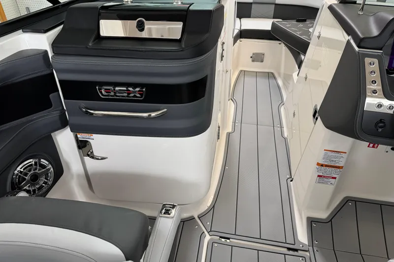 Slide: The Image of Interior of 2026 Chaparral 270 OSX boat, featuring sleek design and modern controls. - 20