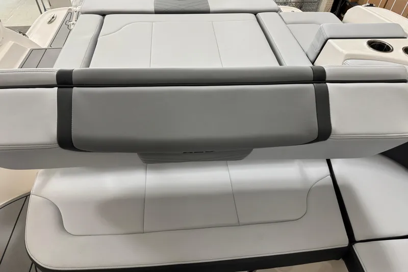 Slide: The Image of 2026 Chaparral 270 OSX boat interior with sleek, modern seating design. - 26