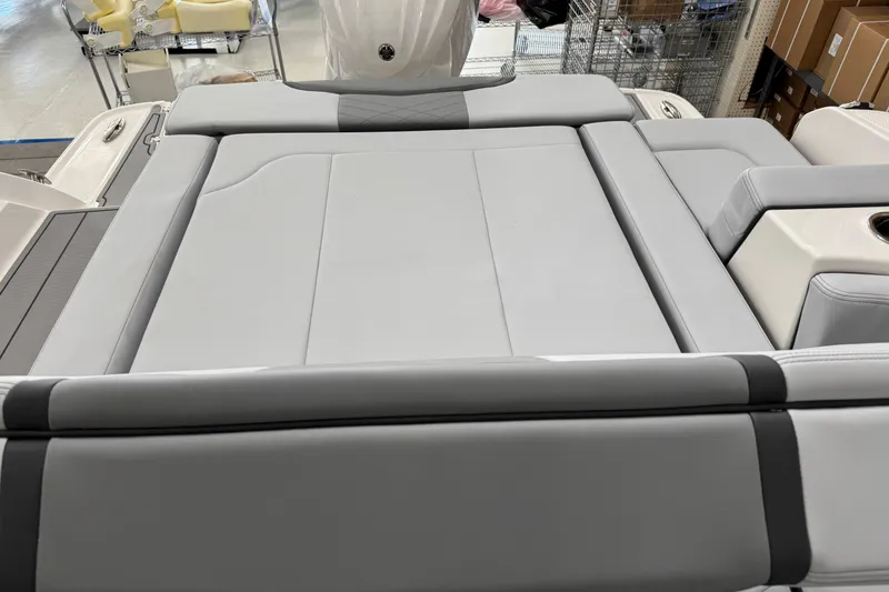 Slide: The Image of Luxurious seating on 2026 Chaparral 270 OSX boat, featuring sleek gray upholstery. - 27