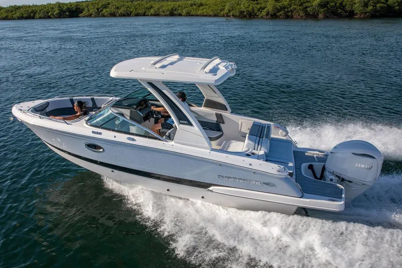 Slide: The Image of Manufacturer Provided Image: 2026 Chaparral 270 OSX boat cruising on water with passengers onboard. - 3