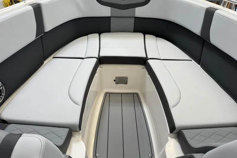 Slide: The Image of 2026 Chaparral 270 OSX boat interior with sleek, modern seating and stylish design. - 35