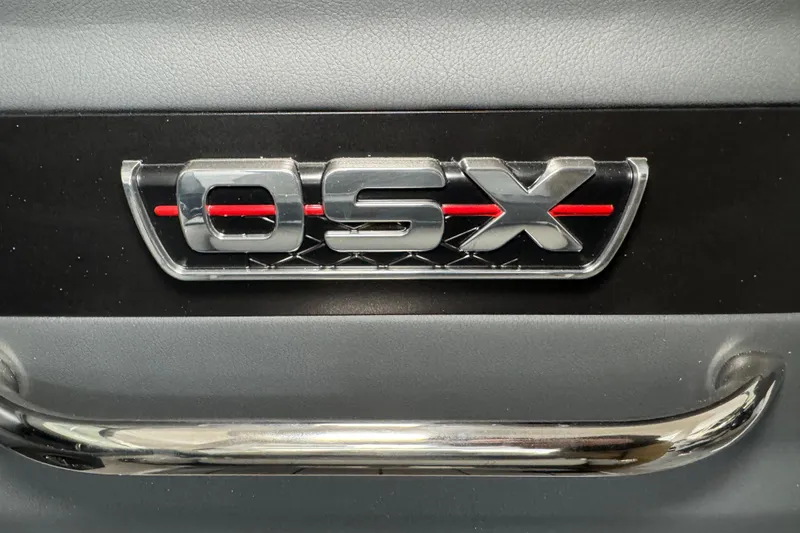 Slide: The Image of 2026 Chaparral 270 OSX emblem with sleek chrome and red detailing. - 36