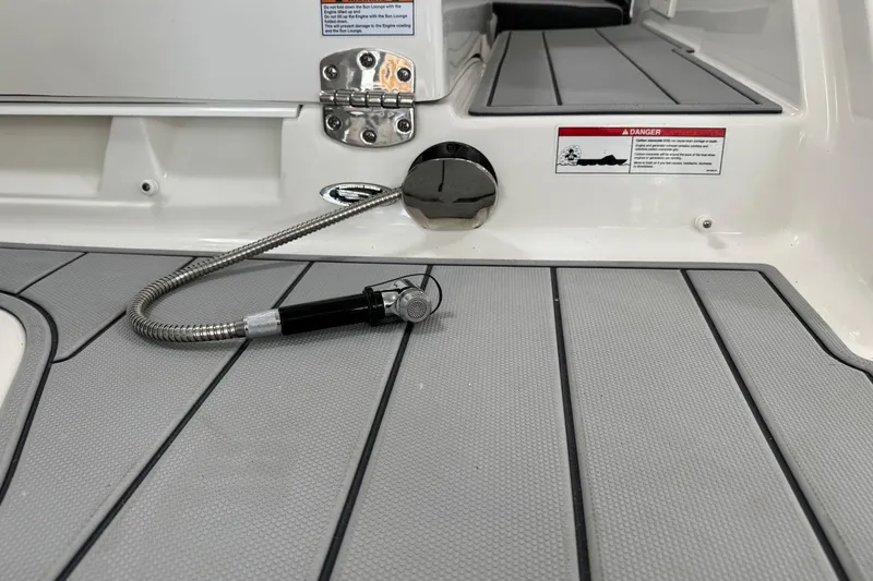 Slide: The Image of 2026 Chaparral 270 OSX boat deck with retractable shower hose. - 39