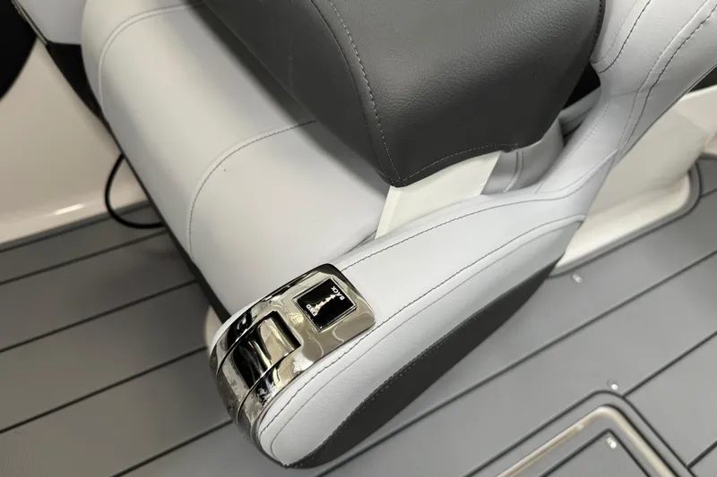 Slide: The Image of 2026 Chaparral 270 OSX boat seat with sleek controls and modern design. - 40