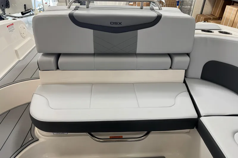 Slide: The Image of 2026 Chaparral 270 OSX boat interior seating, featuring modern gray upholstery and sleek design. - 41