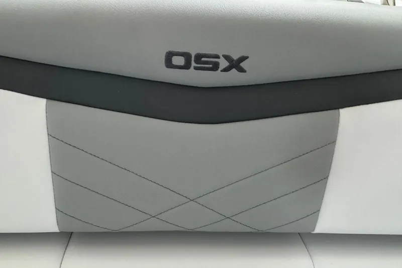 Slide: The Image of 2026 Chaparral 270 OSX boat interior with sleek gray upholstery design. - 42