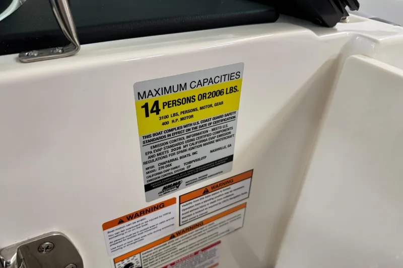 Slide: The Image of Maximum capacity label on 2026 Chaparral 270 OSX boat, indicating 14 persons or 2006 lbs. - 44