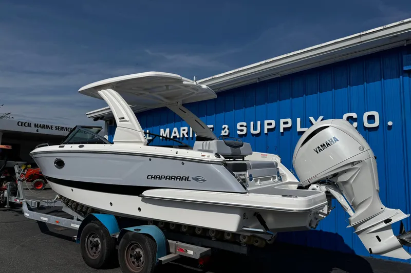Slide: The Image of 2026 Chaparral 270 OSX boat with Yamaha engine at marine supply store. - 6