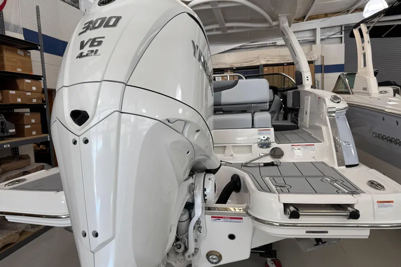 Slide: The Image of 2026 Chaparral 270 OSX boat with Yamaha 300 V6 engine in showroom. - 7