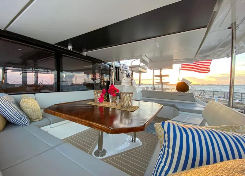 Slide: The Image of Leopard 50 Yacht, 2020, featuring elegant interior and ocean view at sunset. - 18