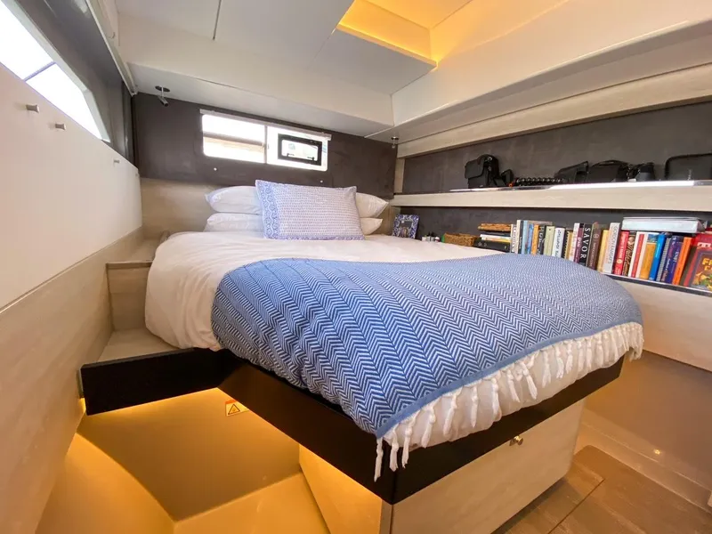Slide: The Image of Luxurious bedroom on Leopard 50 yacht, 2020 model, with bookshelf and stylish design. - 27